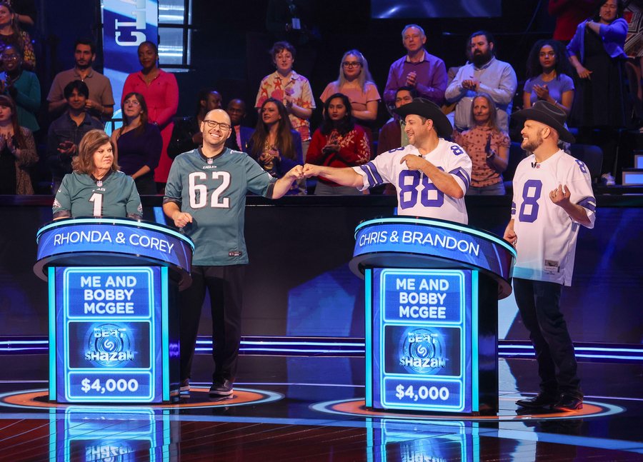 Contestants in football jerseys shaking hands on Beat Shazam